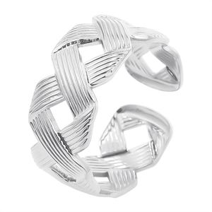 Macro detail of silver-toned braided weave pattern on adjustable open band ring