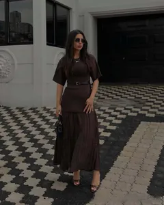Deep brown women's matching set with round neck top and pleated long skirt with waist belt