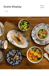 Detailed close-up of blue floral ceramic tableware set on a wooden table with food