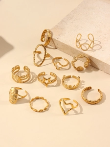 Close-up of 11-piece 18k gold plated ring set featuring star moon and crown motifs