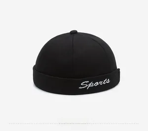 Detail of Sports cursive embroidery on a black cotton twill Miki Hat in retro style