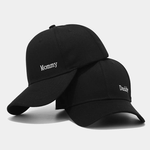 Set of black Daddy and Mommy baseball caps with white side embroidery for couples