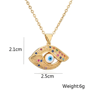 Detail view of evil eye pendant dimensions 2.1cm by 2.5cm and weight 6g in gold finish