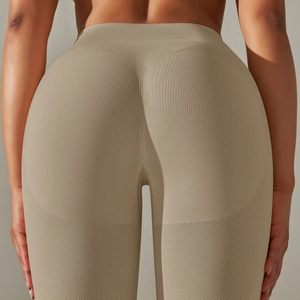 Detail of seamless yoga leggings in khaki with breathable knit and peach lift design