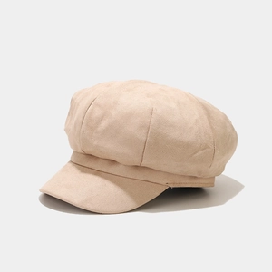 Detail of beige faux suede newsboy hat with octagonal stitched crown for women