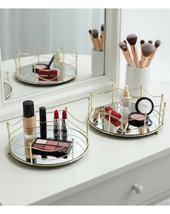 Macro detail of round gold mesh mirror tray for luxury jewelry and cosmetics storage