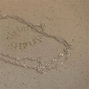Minimalist 925 sterling silver water wave chain necklace with a polished metallic shine