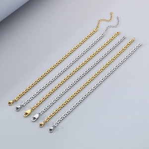 Detail of U-link chain bracelets in gold and silver with lobster clasp and extender