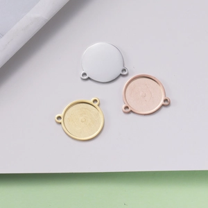 Three 15mm round stainless steel jewelry pendants in silver, gold and rose gold colors