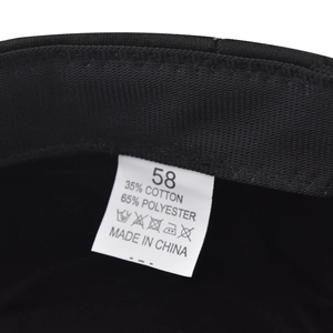 Detail of military cap lining with 58cm size label and cotton-polyester fabric tag