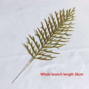 Detail of 36cm sparkling gold glitter leaf spray for festive holiday home decoration