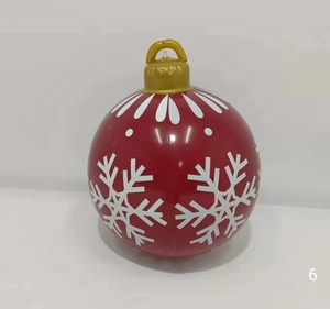 Macro detail of 60cm inflatable PVC Christmas ball with white snowflake prints and gold hook