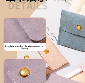 Close-up of microfiber jewelry pouch with metal snap button and precise stitching detail
