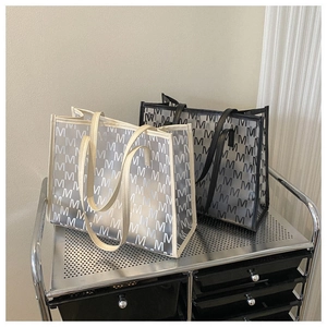 Macro detail of large capacity transparent PVC tote bags with stylish pattern print