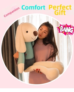 Large plush bunny with mint green striped shirt held by a woman to show its massive size