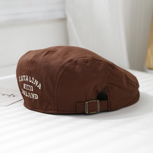 Detail of vintage brown canvas beret with Catalina Island 1983 embroidery and metal buckle