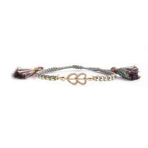 Rainbow woven bracelet with gold double heart zircon charm and tassel details