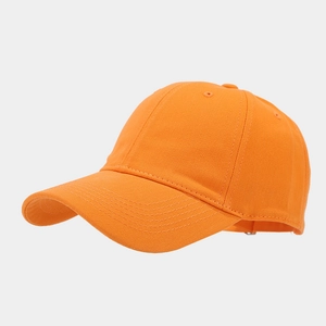 Close-up of bright orange twill cotton baseball cap showing side profile and curved brim
