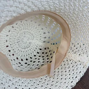 Close-up of adjustable inner drawstring and sweatband in woven crochet bucket hat
