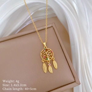 Detail of gold dreamcatcher necklace with colorful gems on silk background