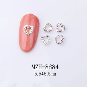 Detailed view of silver heart nail art charms with iridescent rhinestones in 5.5mm size
