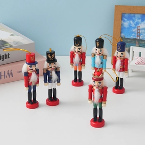 Set of six colorful wooden Nutcracker soldier ornaments with gold hanging strings