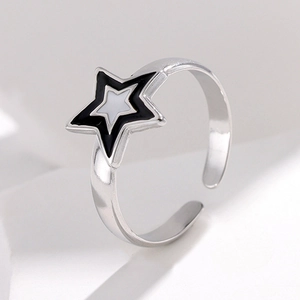 Polished silver adjustable star ring with layered black and white five-point star design