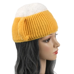 Side view of handmade beer mug knit hat with yellow body and white foam texture