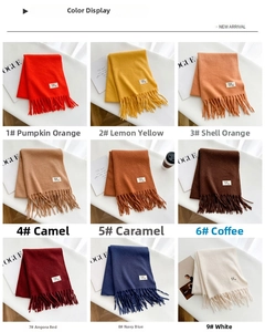Close-up of fringe details and soft texture on solid thick cashmere-like scarves