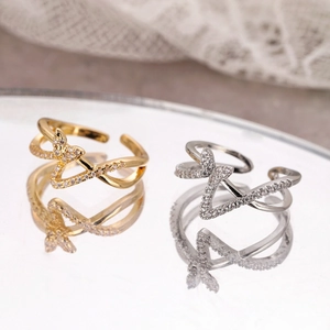 Elegant adjustable butterfly criss-cross rings in gold and silver finish with crystals