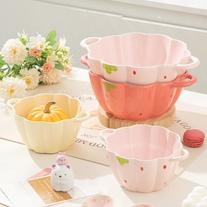 Pumpkin shaped ceramic noodle bowls with handles in pastel pink, orange and yellow colors