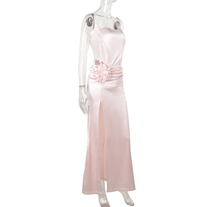 Detail view of pink satin evening gown featuring 3D floral waist and high side slit
