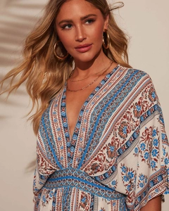 Detail of V-neckline and intricate ethnic floral print on summer short sleeve maxi dress