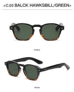 Detail view of round black and tortoiseshell retro sunglasses with dark green lenses