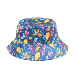 Close-up of a stylish printed bucket hat featuring colorful butterfly and tropical floral patterns