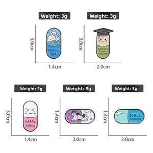 Detailed view of assorted enamel pins with weights and sizes on white background