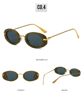 Detail view of oval retro sunglasses with olive green frames and gold metal temples