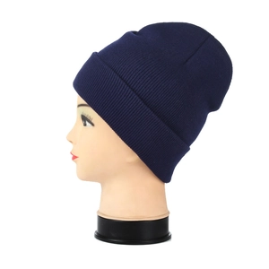 Detail view of the navy blue ribbed knit beanie with a folded cuff on a head model