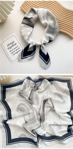 Detailed view of elegant black and white ink-style silk scarf with satin luster finish