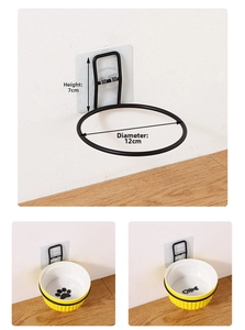 Detail of wall-mounted black metal pet bowl holder with 12cm diameter and adhesive hook