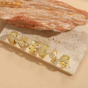Set of 6 irregular geometric 14K gold plated rings and ear cuffs on decorative stone