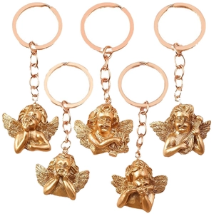 Set of five vintage gold angel keychains featuring various musical instruments and poses