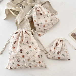 Three-piece set of cartoon bear drawstring storage bags in various sizes with bubble fabric