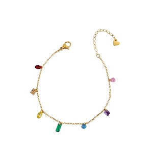 Gold chain bracelet featuring various colorful gemstone charms and heart pendant detail