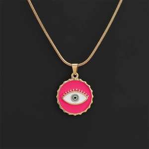 Macro shot of rose pink evil eye pendant with micro-zirconia on a golden snake chain