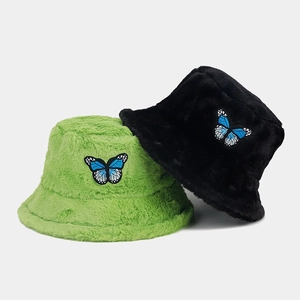 Winter plush bucket hats in green and black with butterfly embroidery details