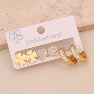 Detailed view of three pairs of gold stainless steel stud earrings with cubic zirconia stones