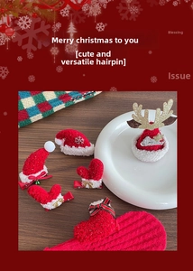 Detail of Christmas plush hair clips with velvet texture and faux fur trim decorations