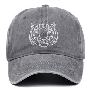 Close-up of intricate tiger head embroidery on a vintage charcoal washed cotton baseball cap