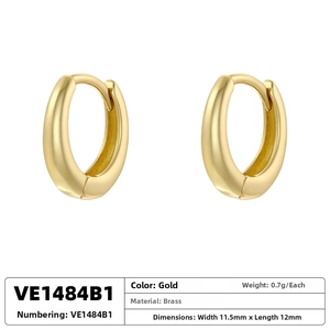 Detailed view of gold plated oval hoop earrings showing brass material and exact dimensions